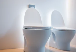 Efficient uus toto smart toilet being installed in a contemporary bathroom, highlighting sleek design and advanced features for user comfort and hygiene.